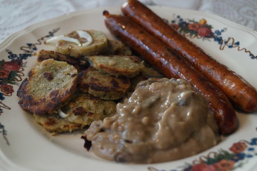 Knödel and lamb sausages with mushroom sauce picture
