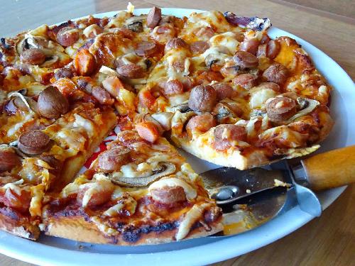 Pizza with hot dogs picture